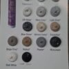 A collection of various silicone sealant colours displayed in circular containers, including shades like translucent, white, off white, misty grey, light grey, blue stone, almond ivory, travertine beige grey, walnut, pewter, monument matt white and matt black.