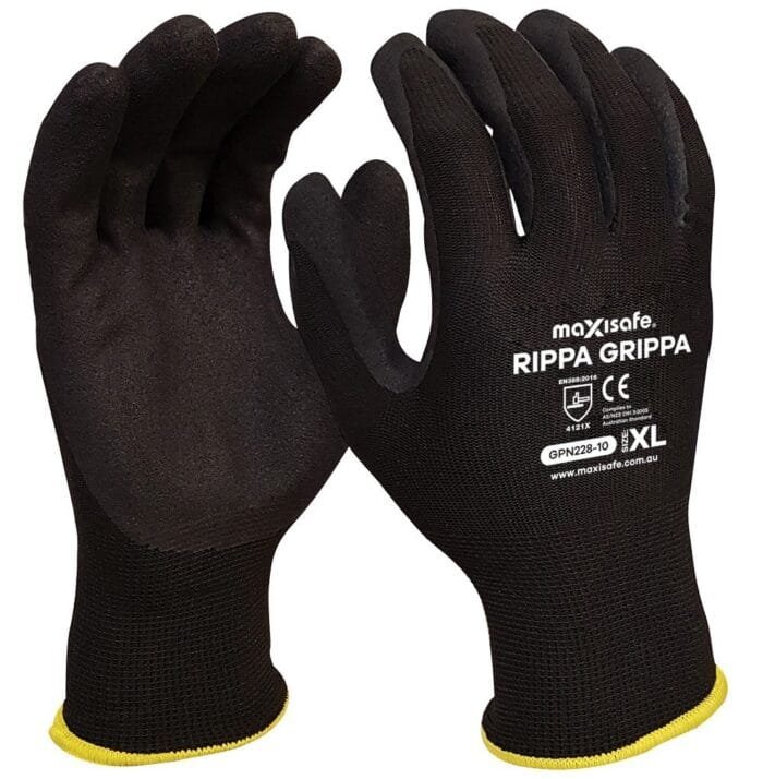 A pair of black gloves with a textured surface and yellow cuffs, labeled with the brand name "maxisafe Rippa Grippa" and CE certification.